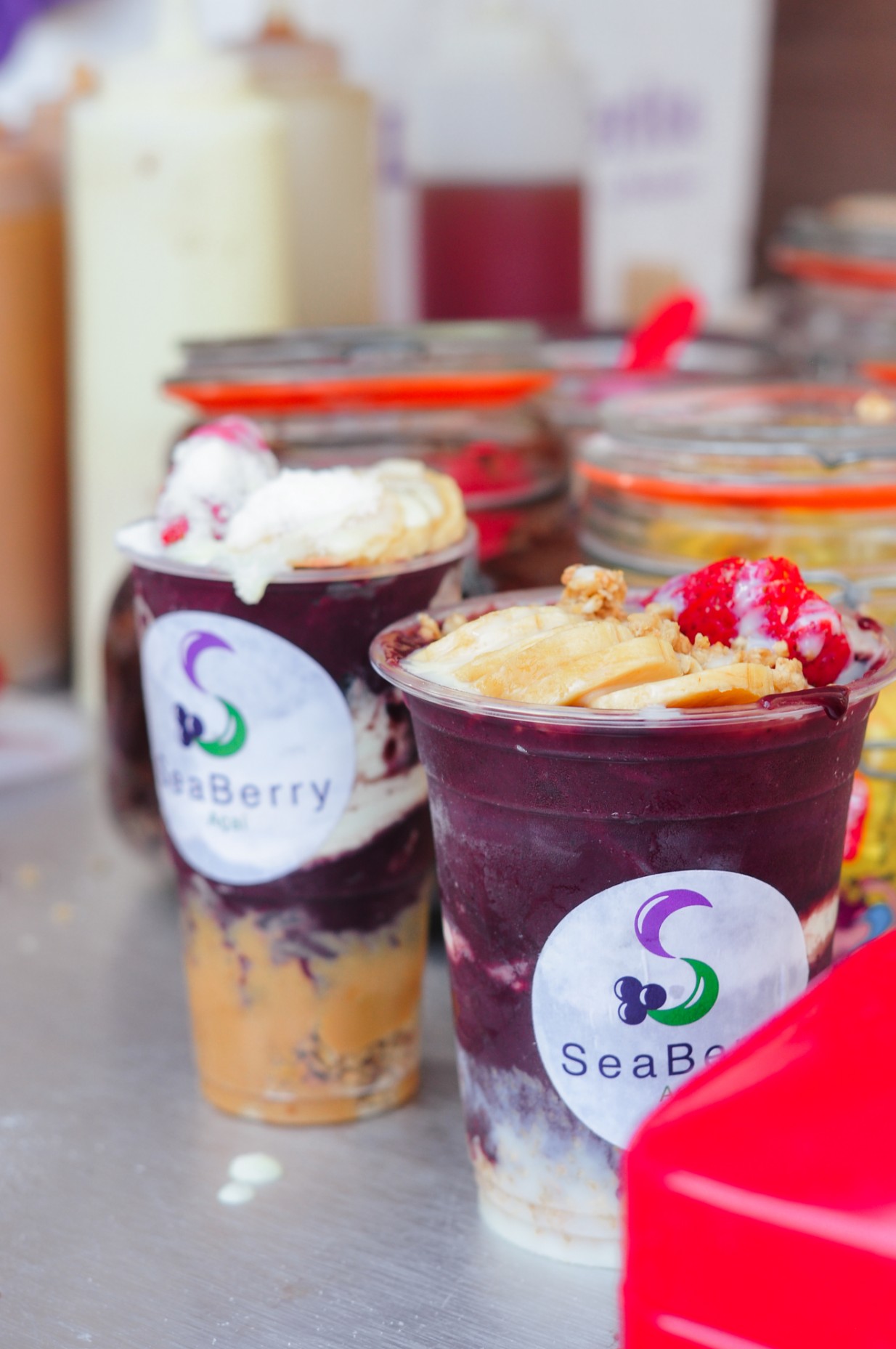 Two colourful açaí bowls on the table